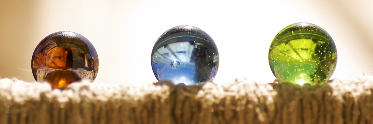 Three different colored marbles in a row